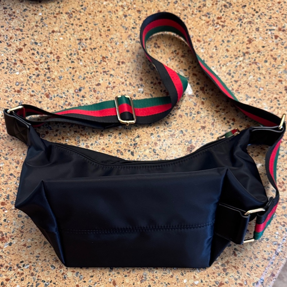 Stylish Black women’s Bag with Multicolor Strap